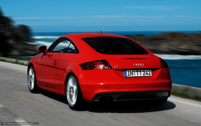 Red Audi TT driving on coastal road
