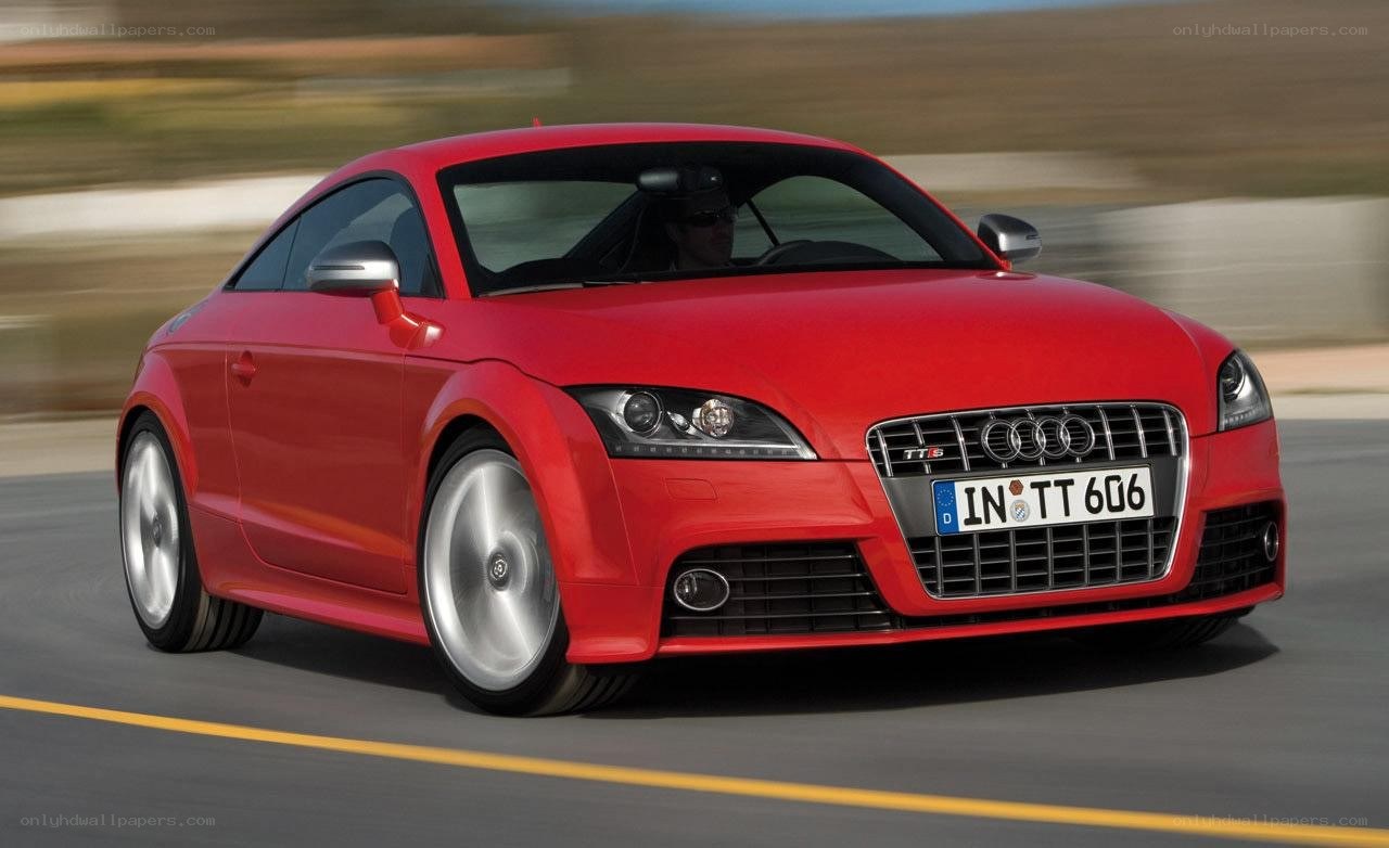 Red Audi TT driving on road