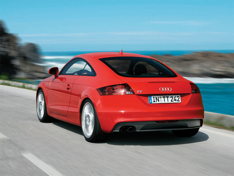 Red Audi TT on coastal road