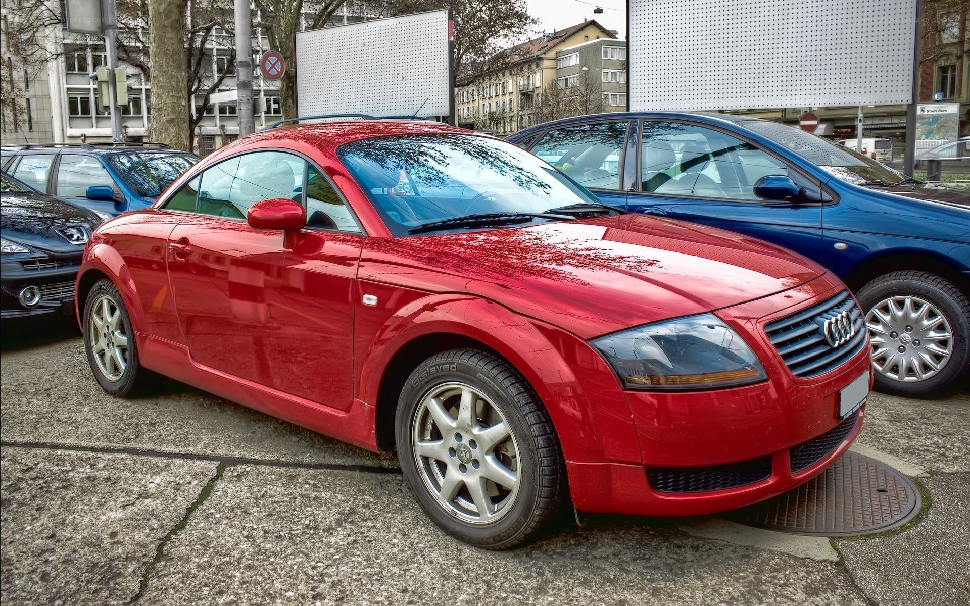 Red Audi TT parked on street