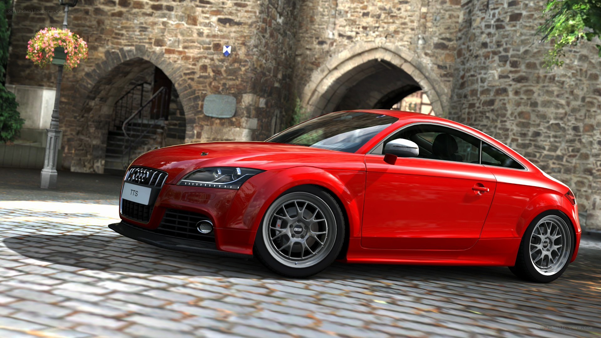 Red Audi TTS on cobblestone street