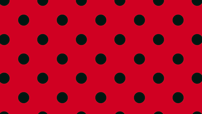 red background with black polka dots