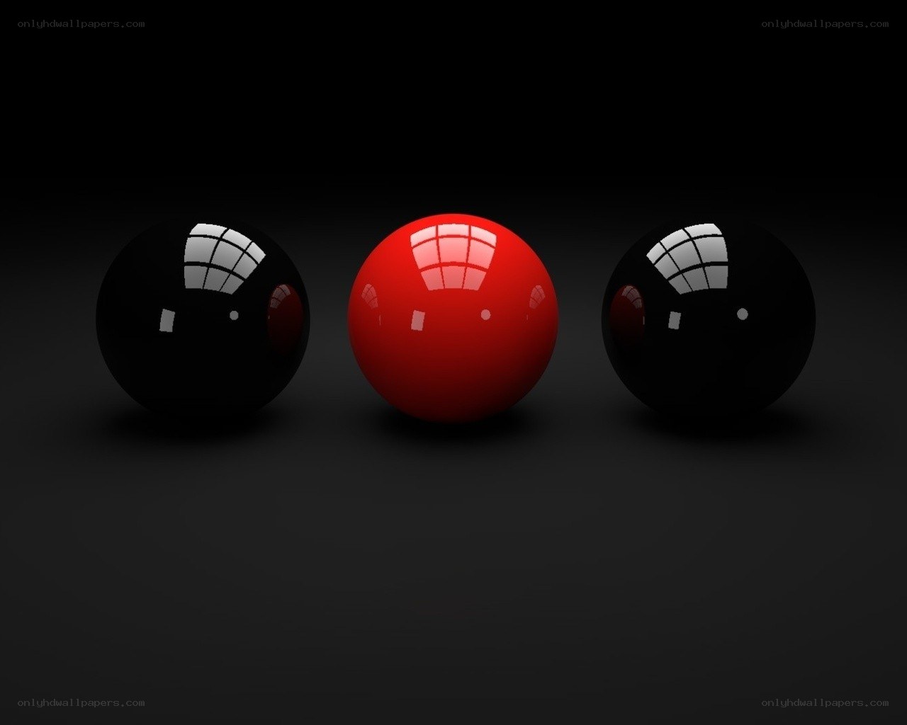 Red ball between two black balls
