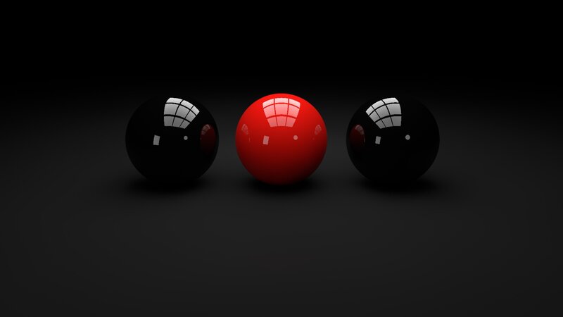 Red ball between two black balls
