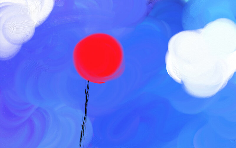 Red balloon in blue sky