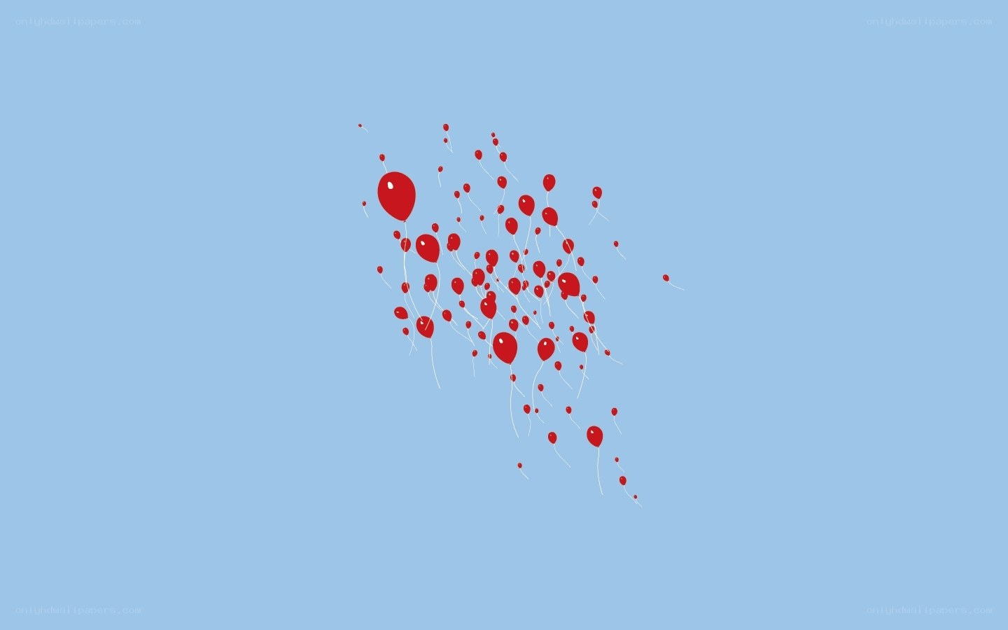Red balloons floating in the sky