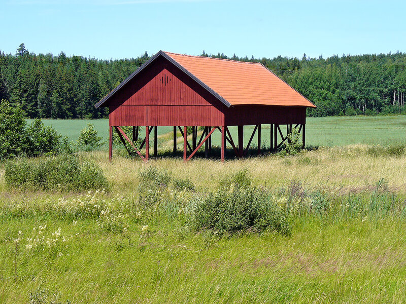 Red barn in a grassy field