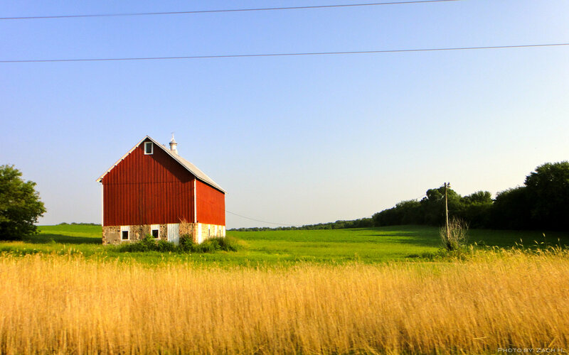Red barn in a green field