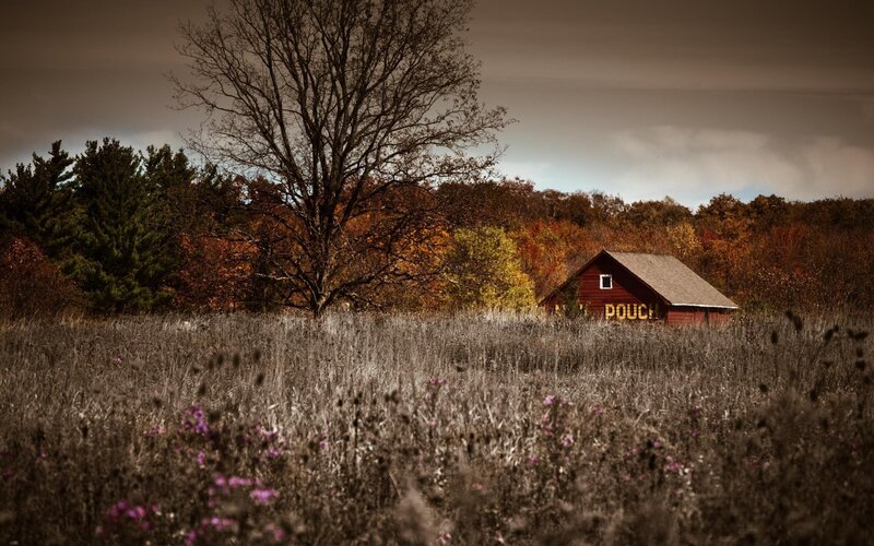 Red barn in autumn field