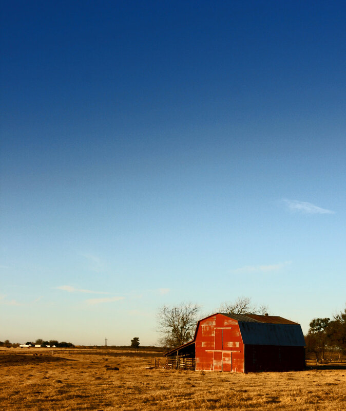 Red barn in open field