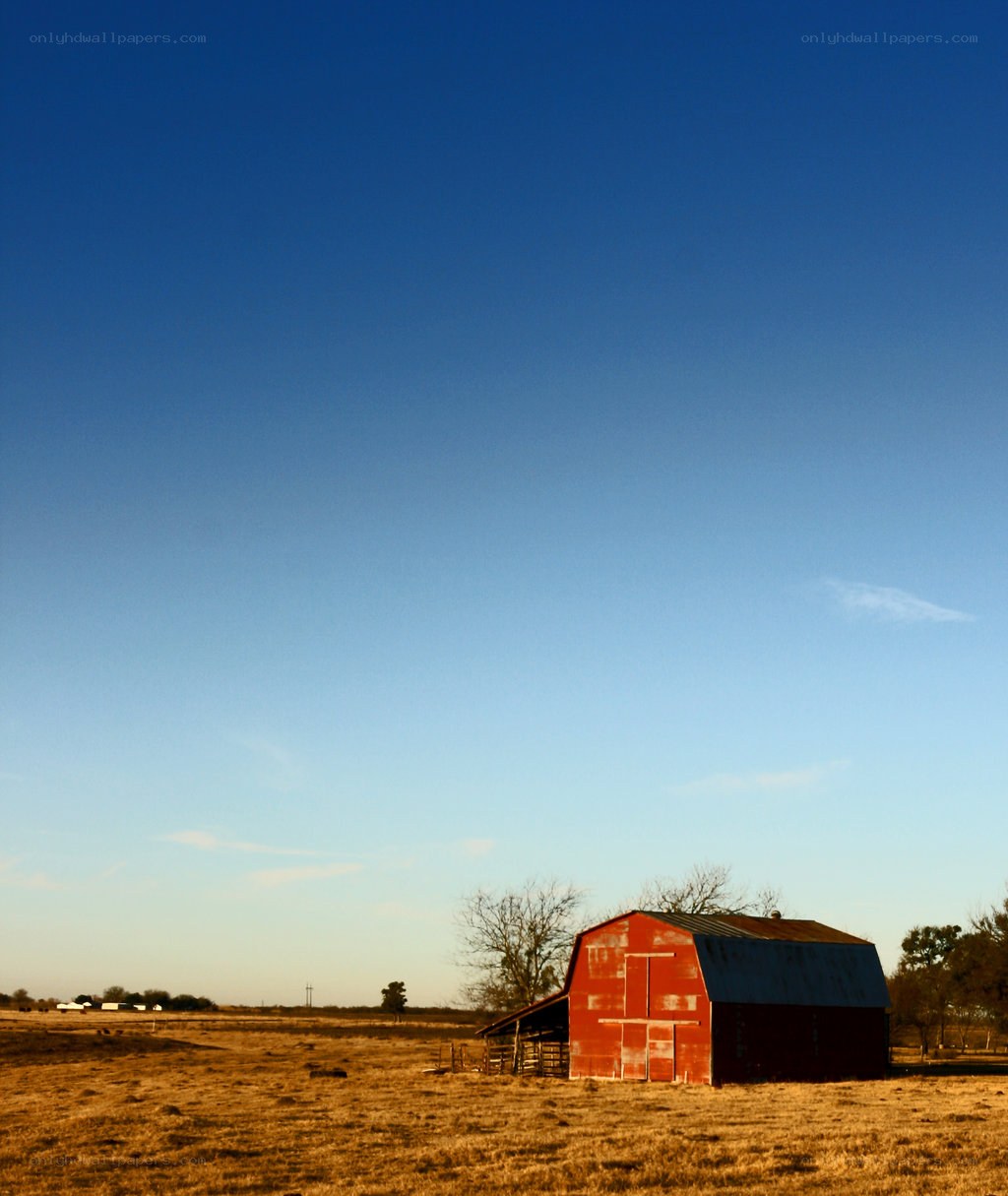 Red barn in open field