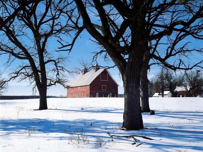 Red barn in snowy field
