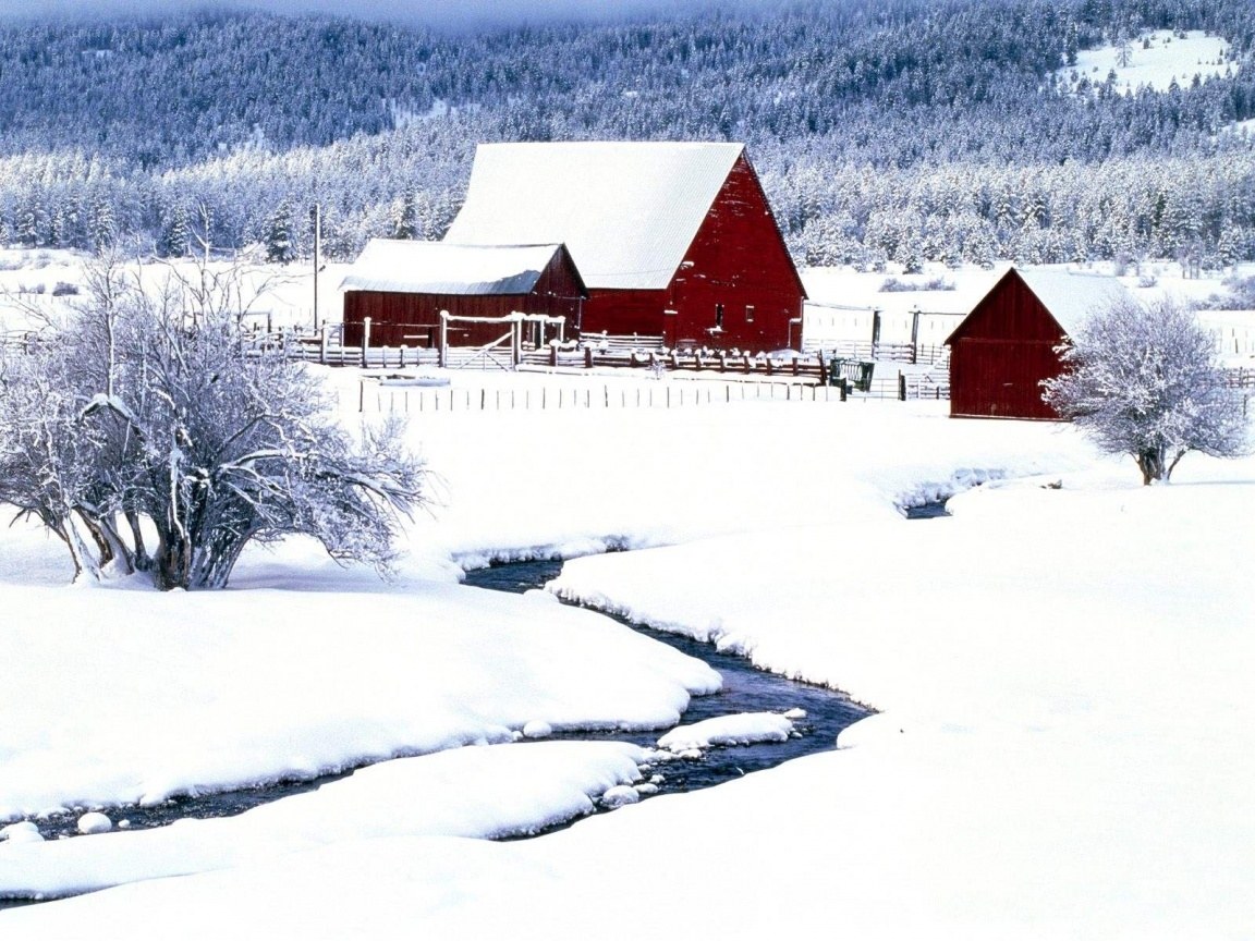Red barn in snowy landscape