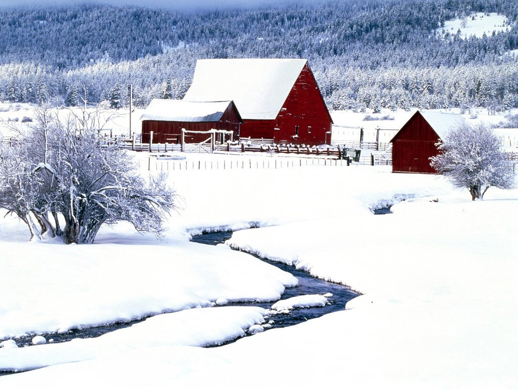 Red barn in snowy landscape