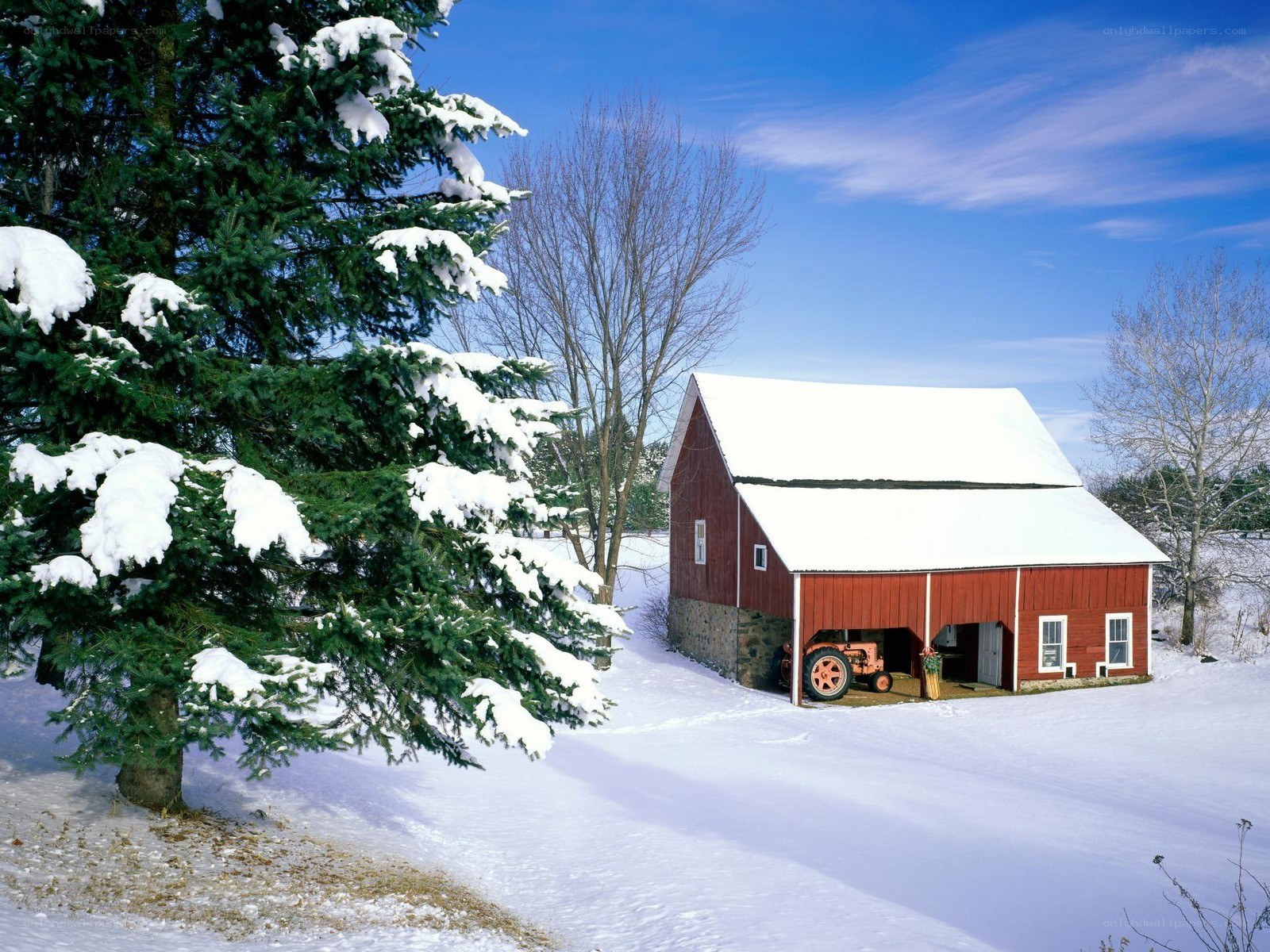 Red barn in snowy landscape