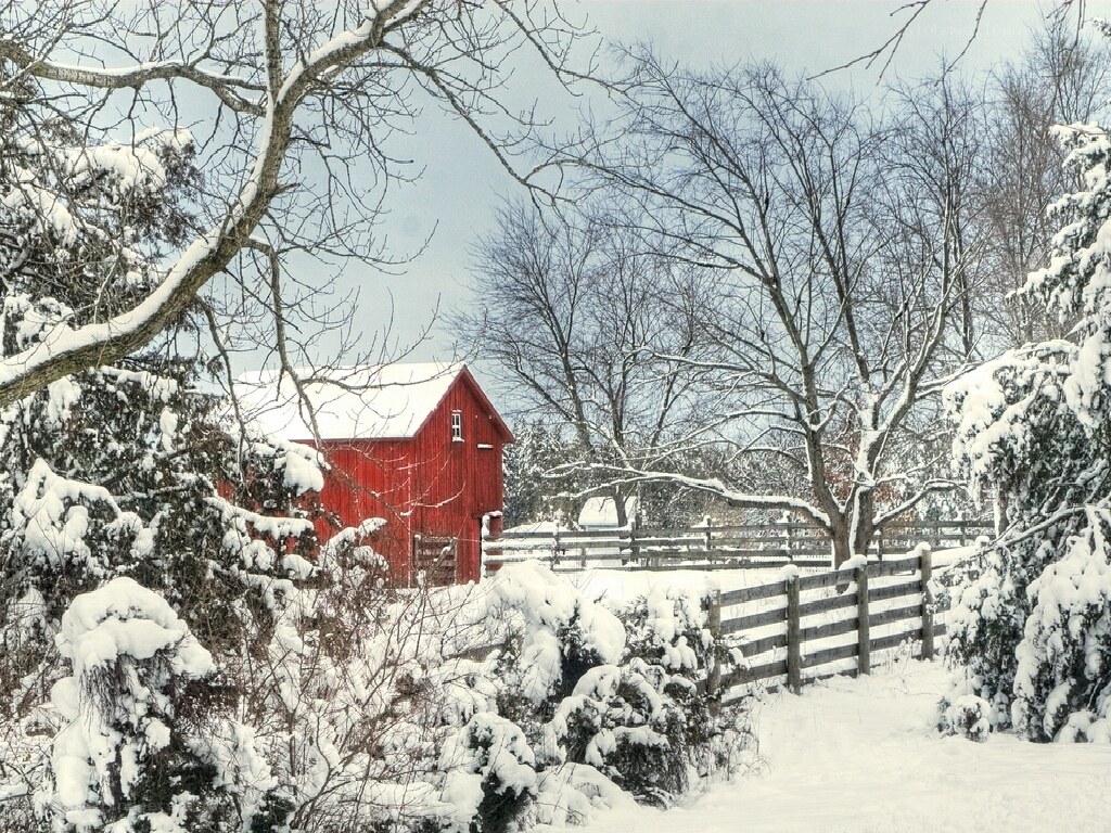 Red barn in snowy landscape