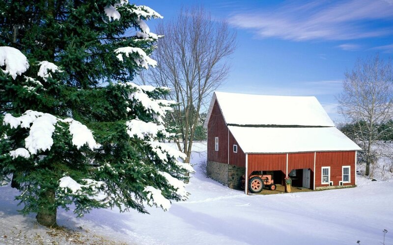 Red barn in snowy landscape