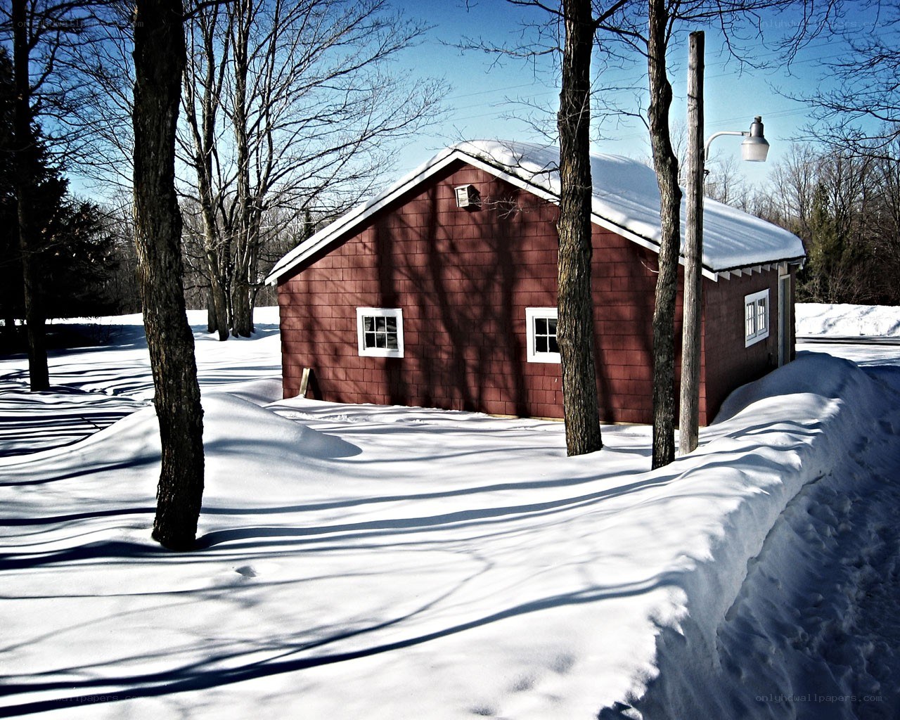 Red barn in snowy landscape