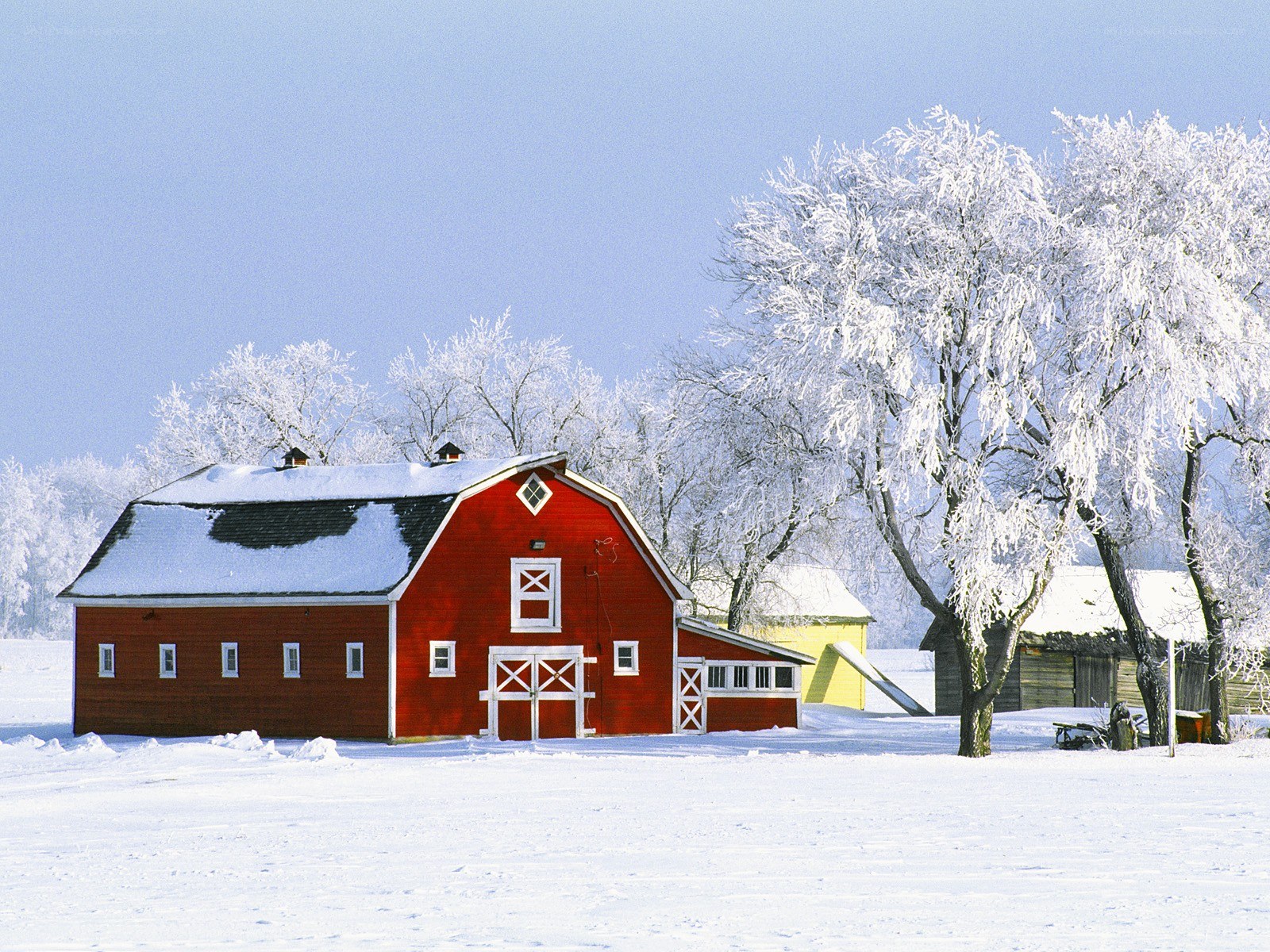 Red barn in winter landscape