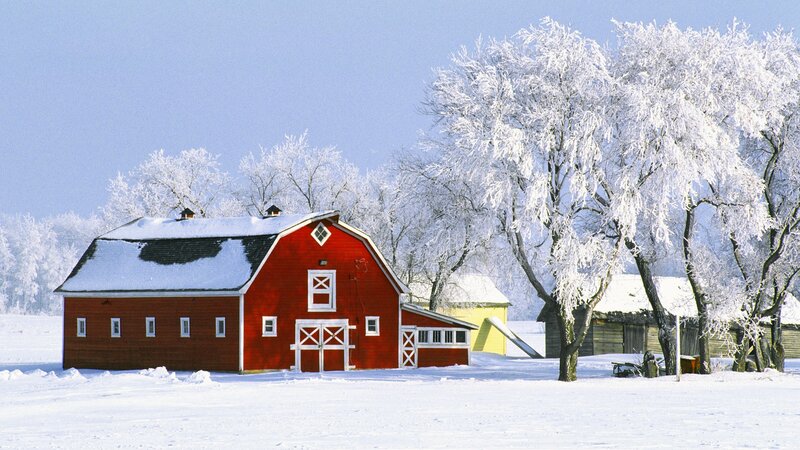 Red barn in winter landscape