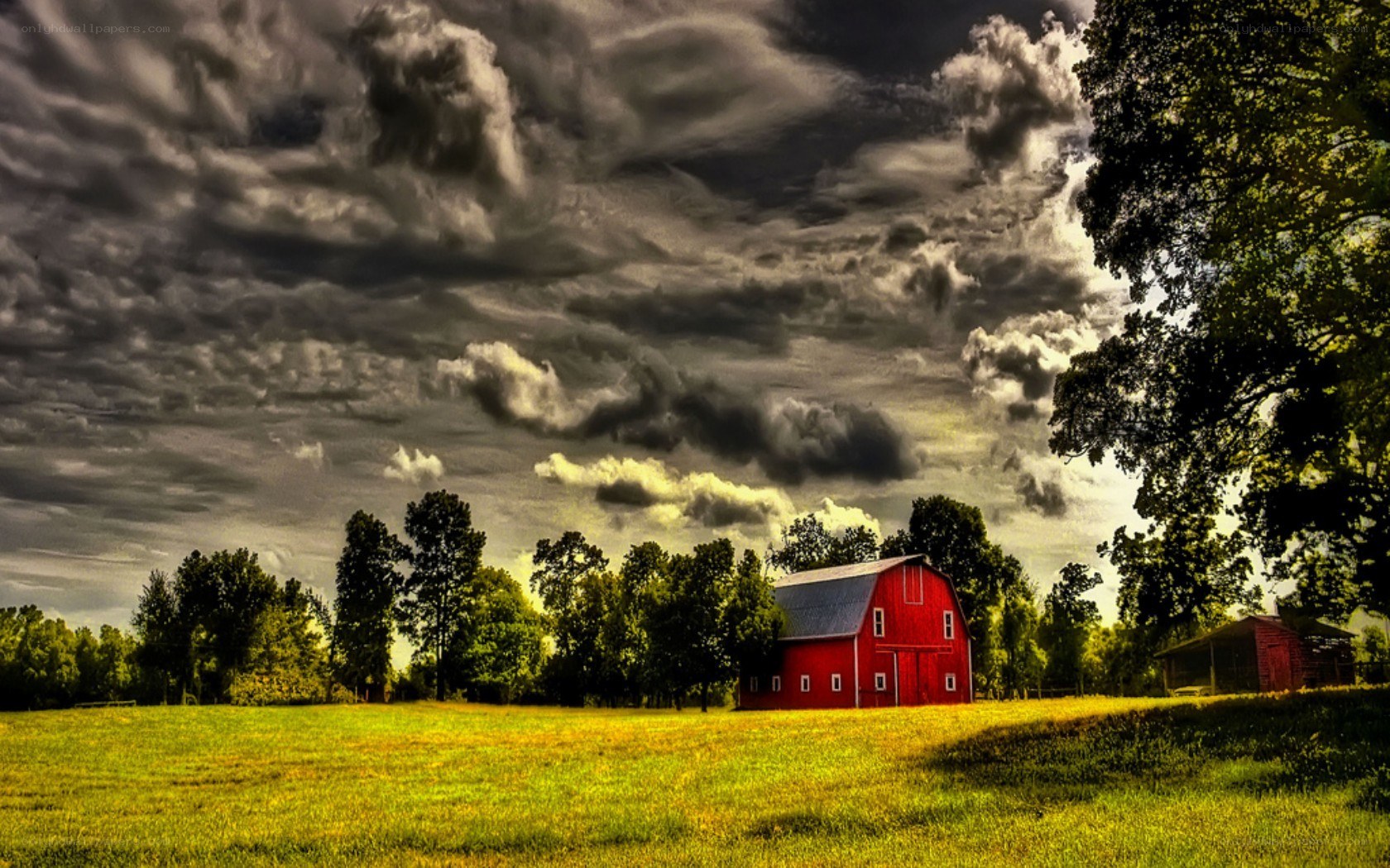 Red barn under stormy sky