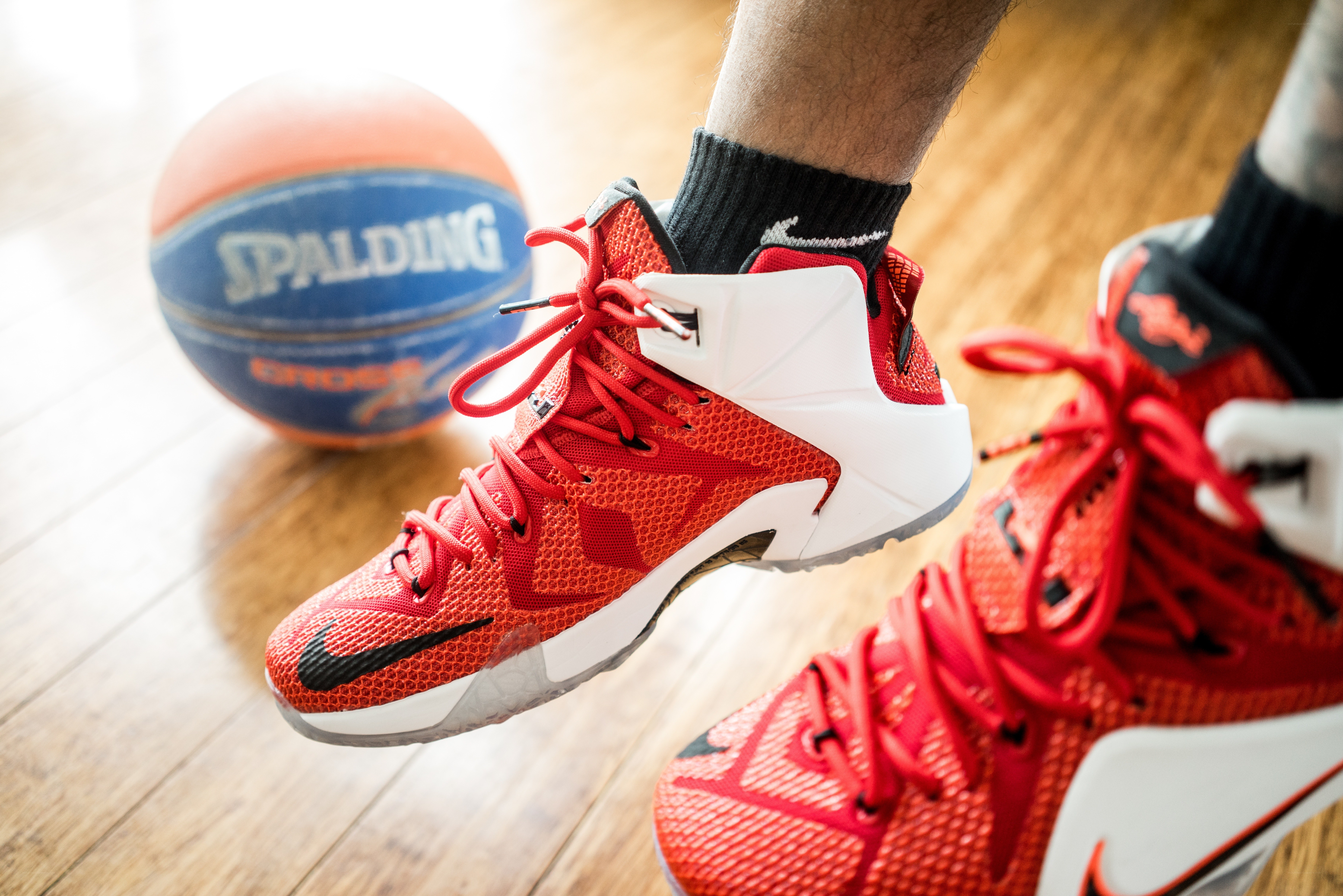 red basketball shoes and ball