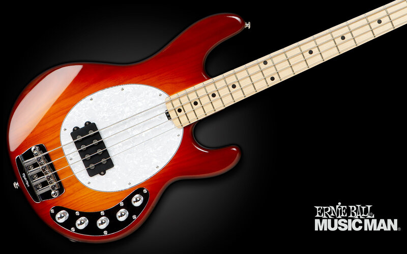 red bass guitar on black