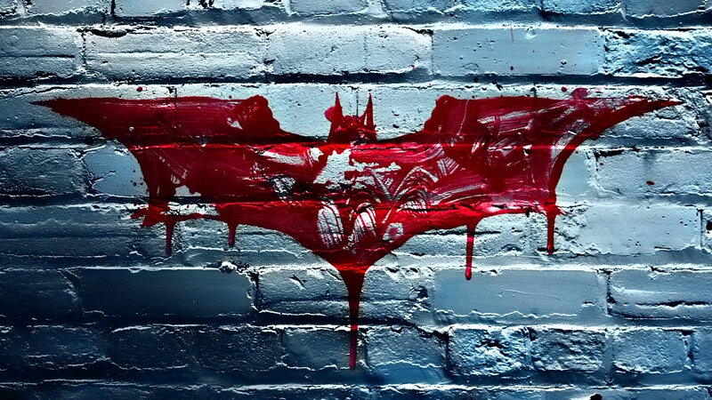 Red Bat Symbol on Wall