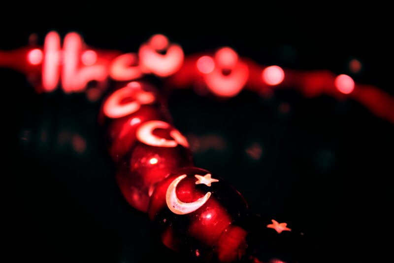 Red beads with moon and star symbols
