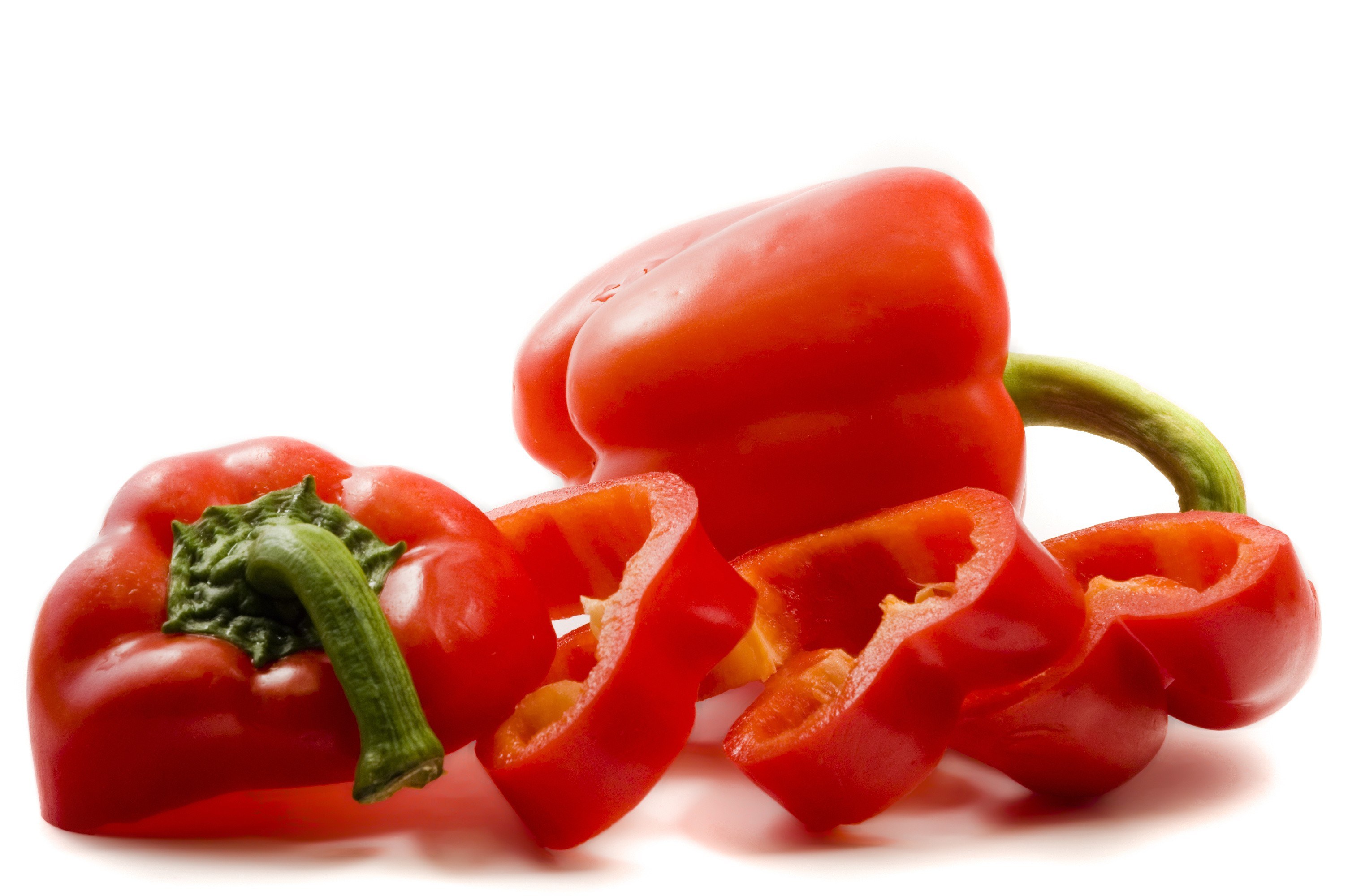 Red bell peppers on white