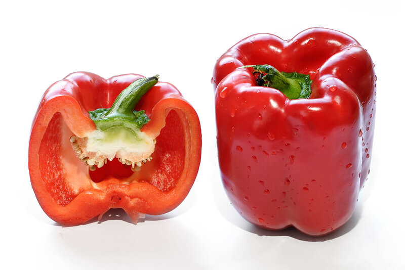 Red bell peppers on white