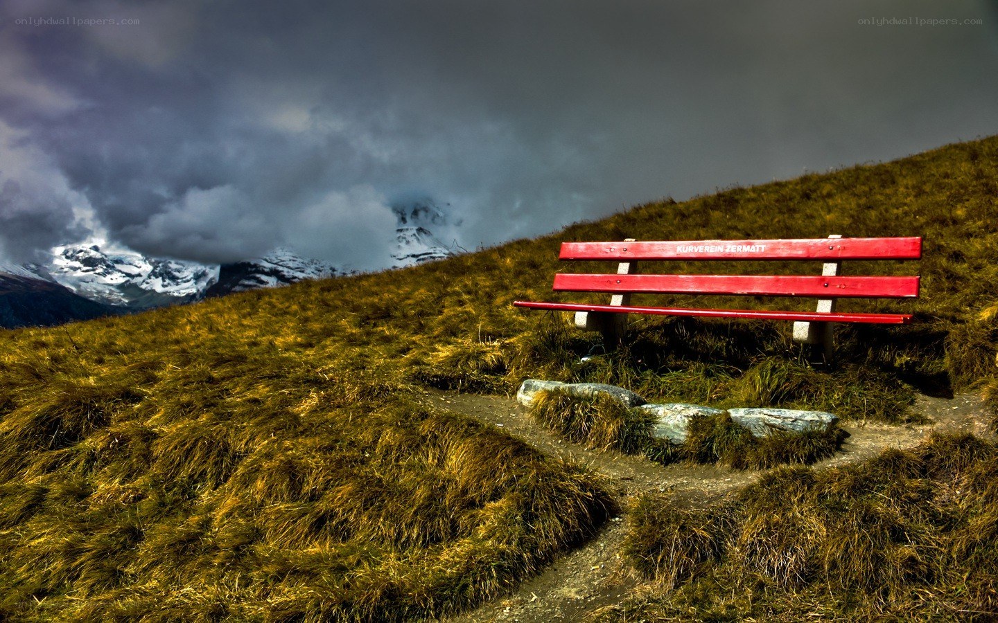 Red bench on a mountain