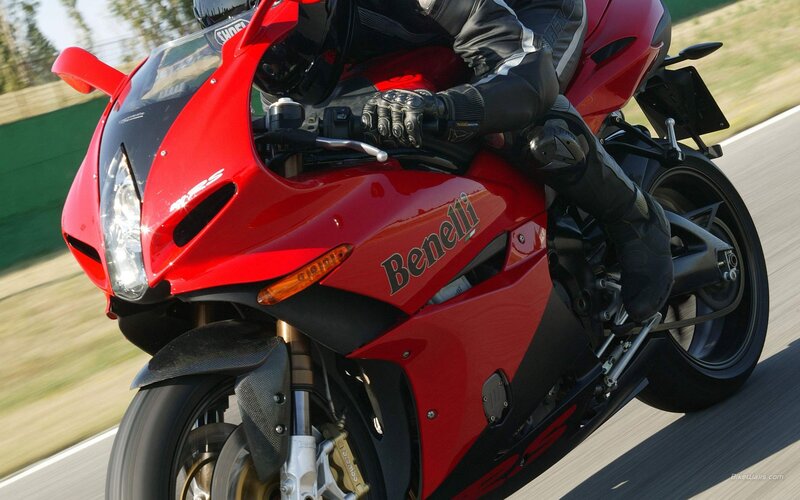 Red Benelli motorcycle in motion