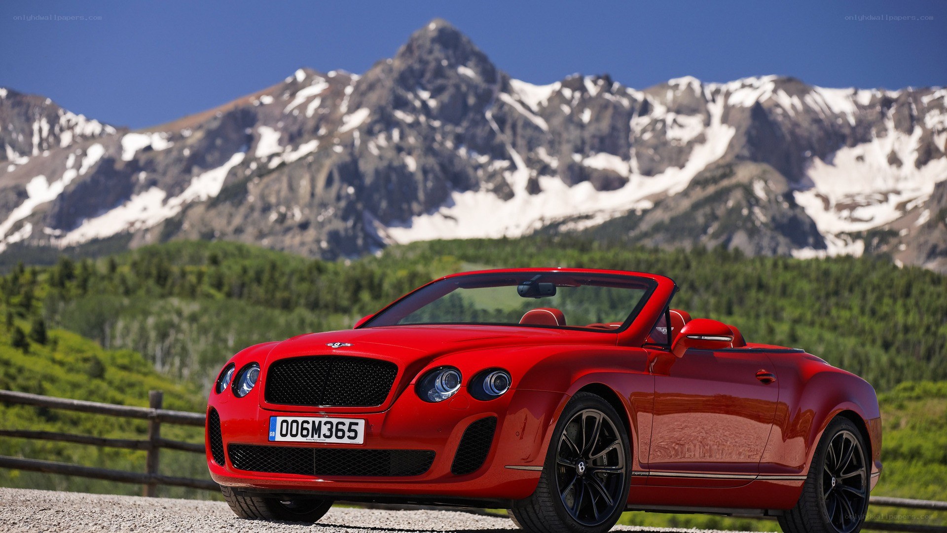 Red Bentley convertible in mountains