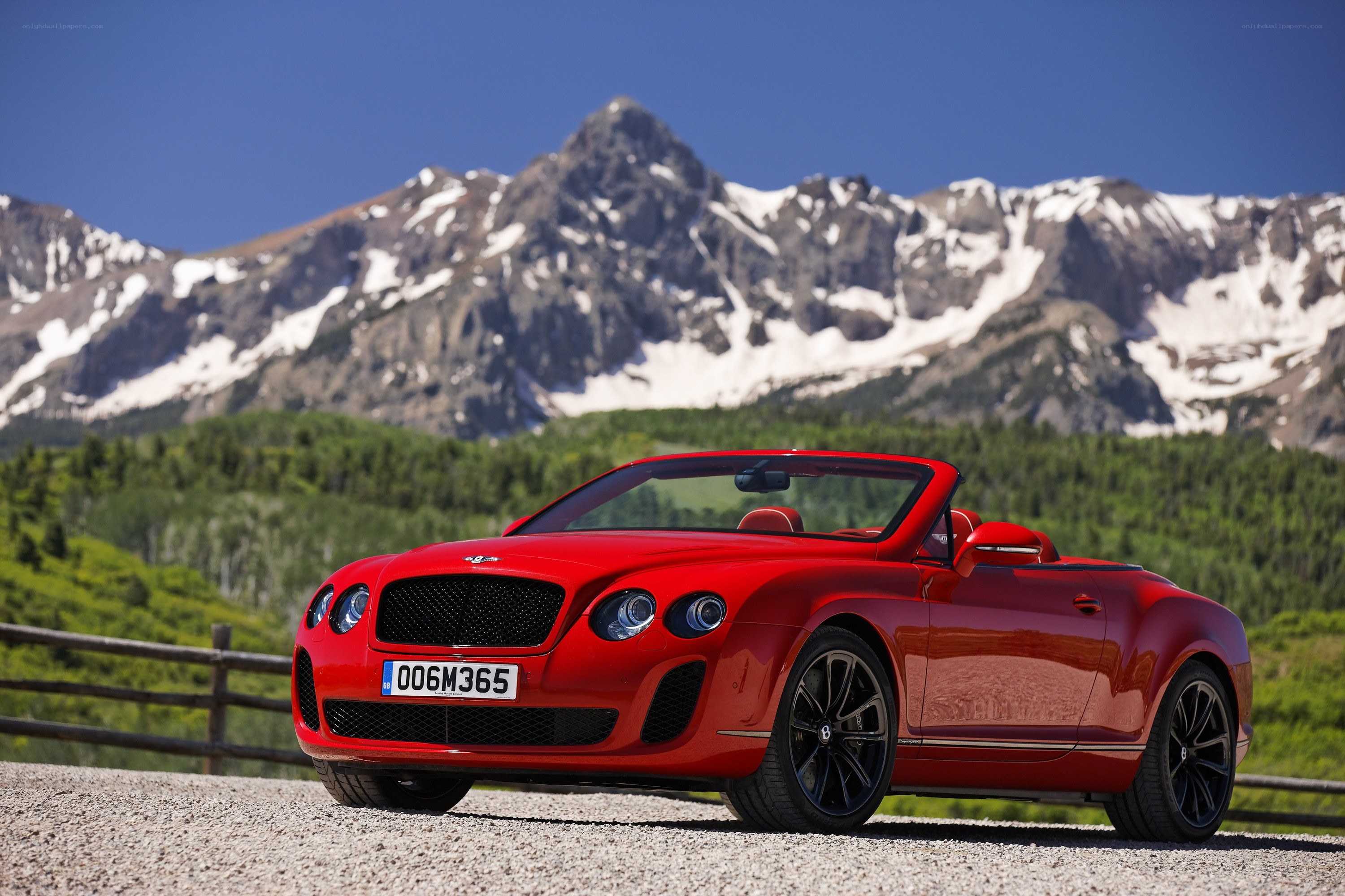 Red Bentley convertible in mountains
