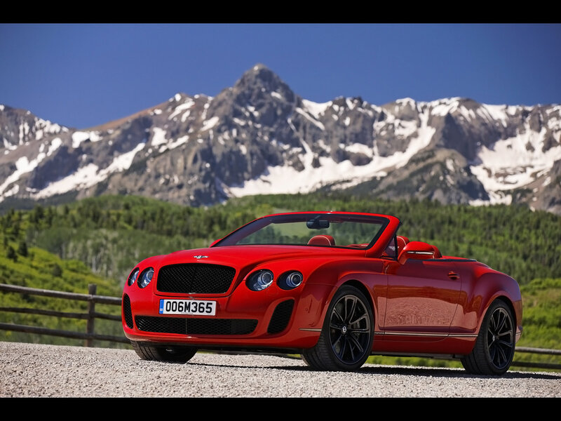 Red Bentley convertible in mountains