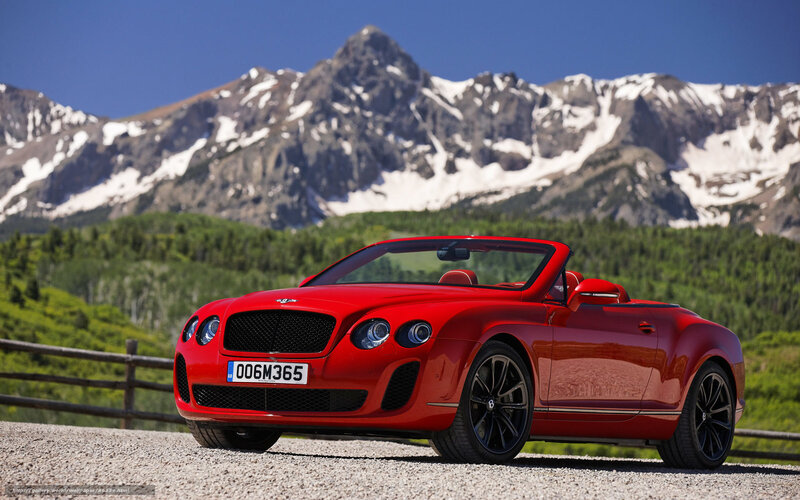 Red Bentley convertible in mountains
