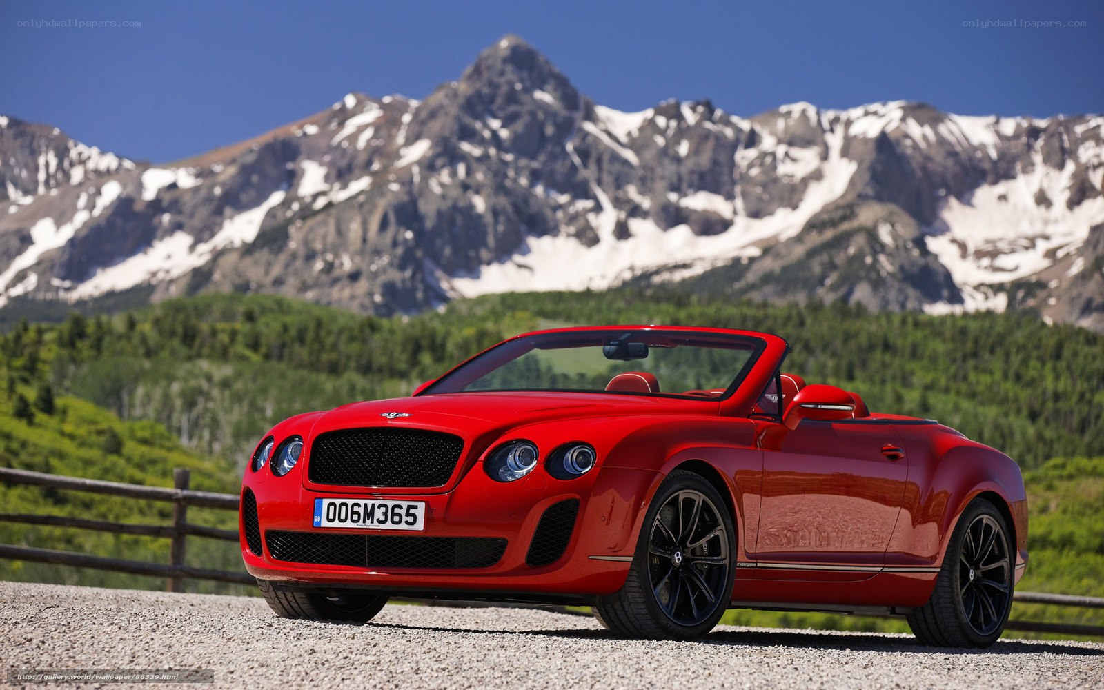 Red Bentley convertible in mountains