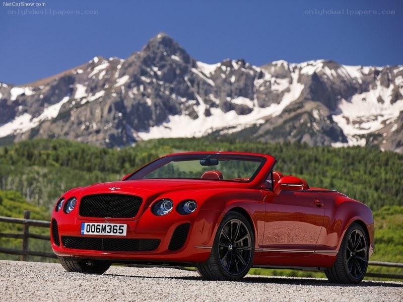 Red Bentley convertible on mountain road