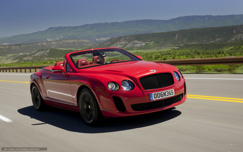 Red Bentley convertible on road
