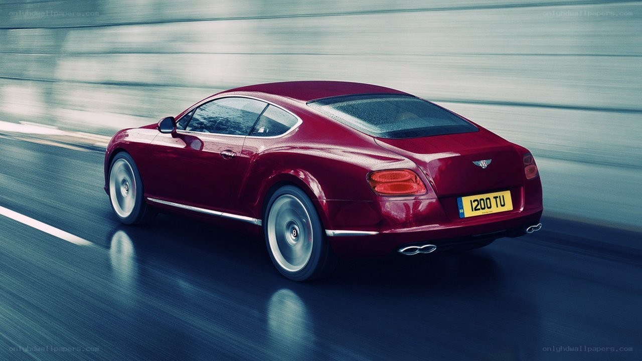 Red Bentley in motion