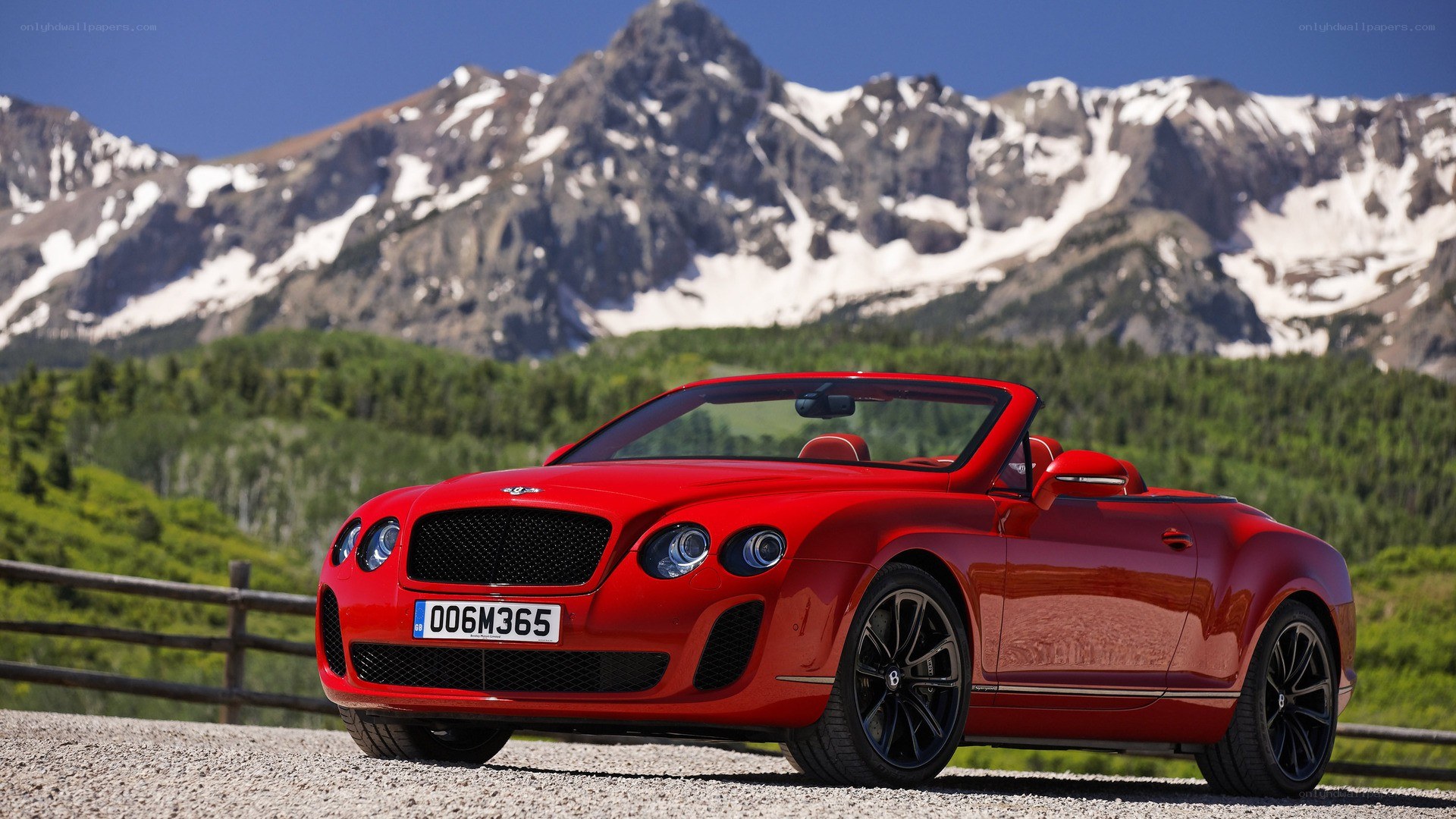 Red Bentley in mountain landscape