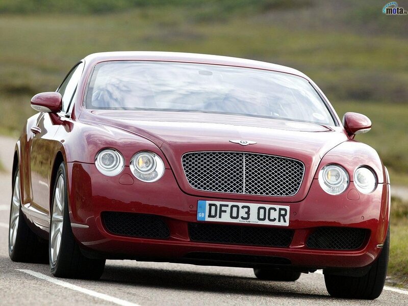 red bentley on a road