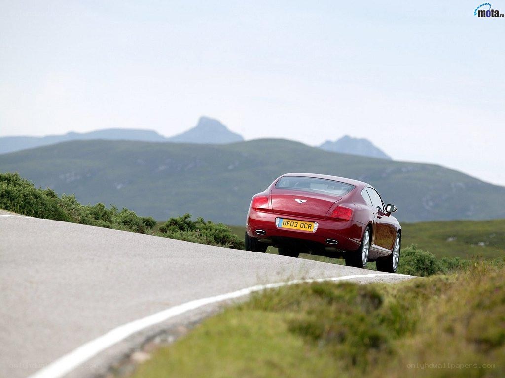 Red Bentley on a winding road