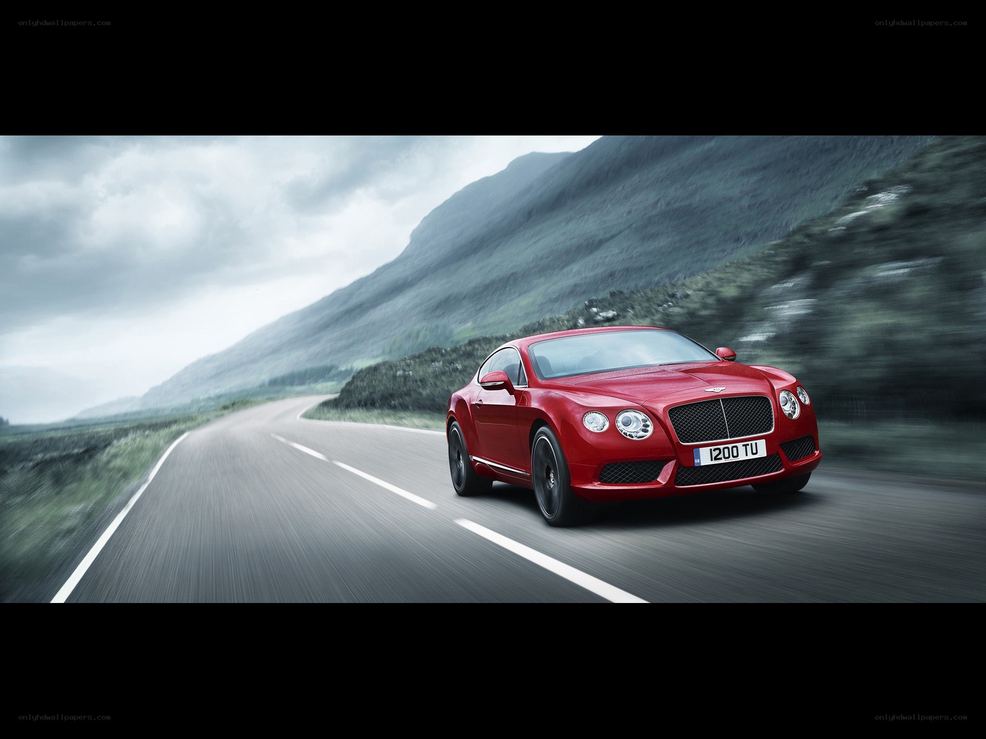 Red Bentley on a winding road