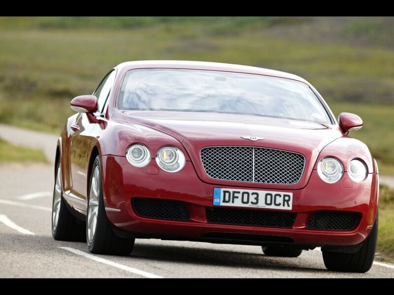 red bentley on country road