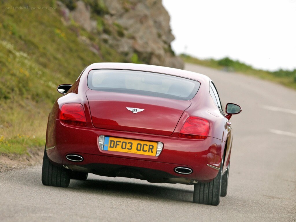 red bentley on winding road