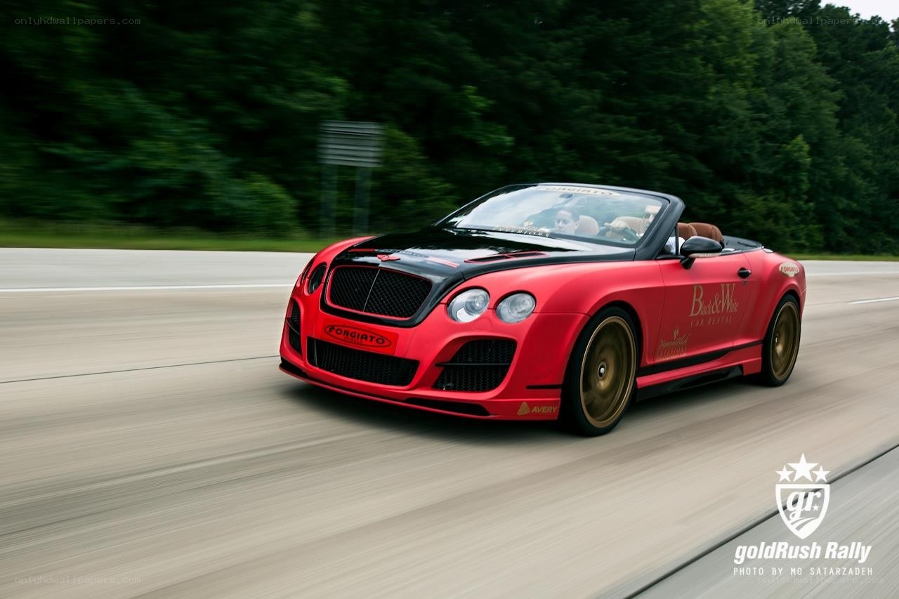 Red Bentley speeding on a road