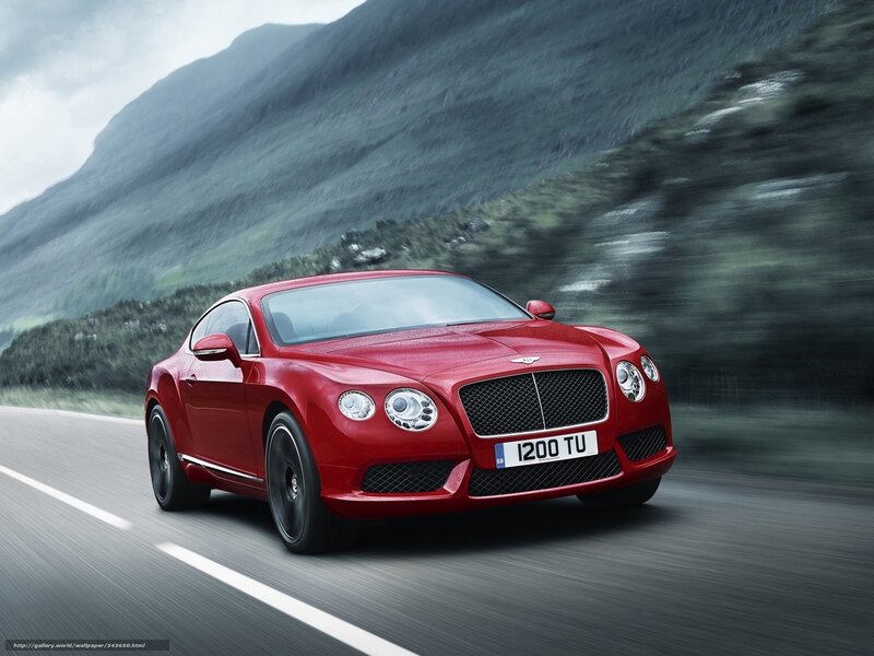 Red Bentley speeding on mountain road