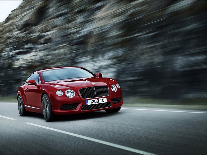 Red Bentley speeding on road